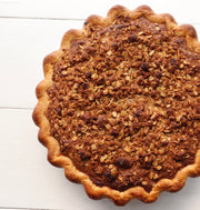 Pie with a pastry base topped with an oat topping